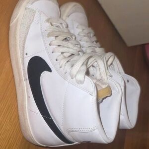 Nike White High-Top Sneakers with Black Swoosh Accent
